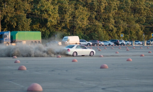 Vehicle Doing Donuts in Parking Lot - Thumbnail