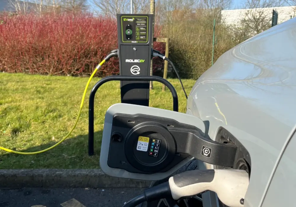 EV Charger and EV car plugged in charging