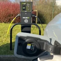 Blog Thumbnail Wide EV Car plugged in at EV Charging point at workplace